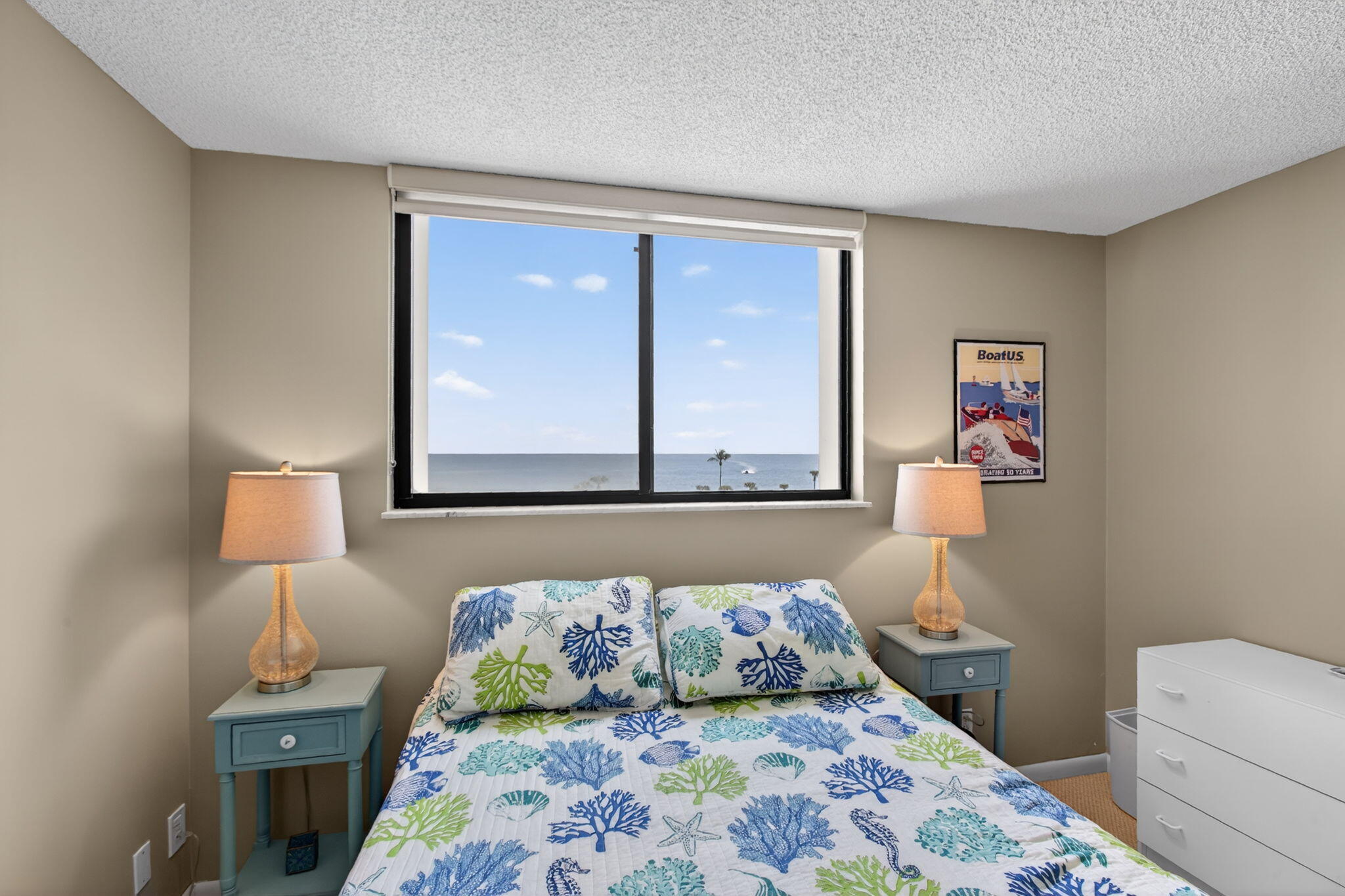200 Ocean Trail Way, Unit 405 Jupiter, FL 33477 - Photo 19 of 46 a bedroom with a bed and a window