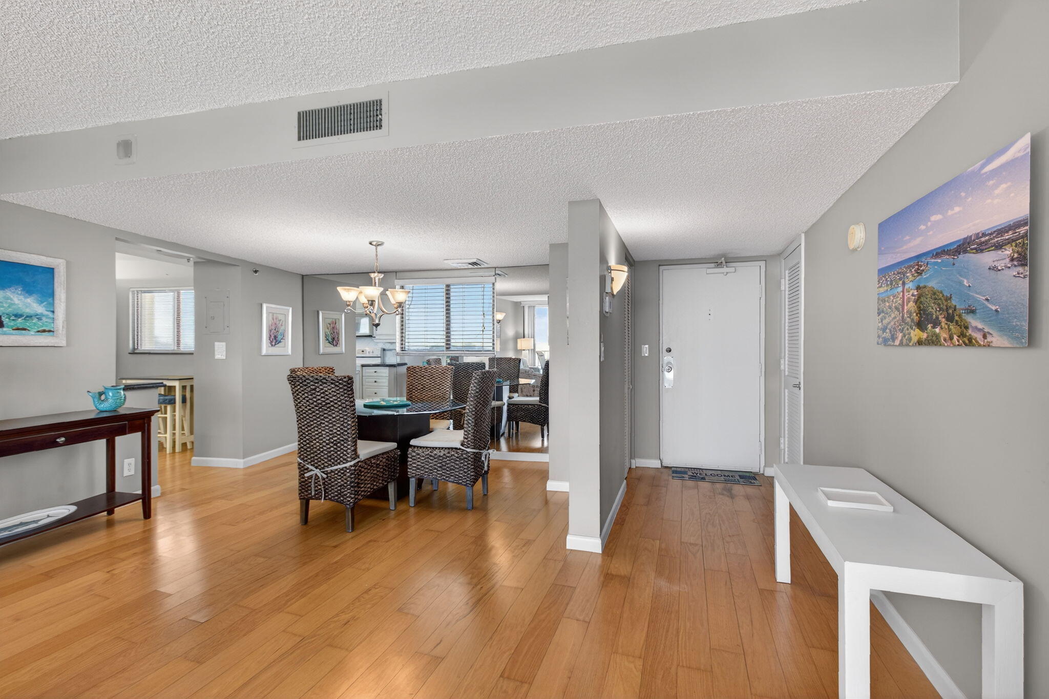 200 Ocean Trail Way, Unit 405 Jupiter, FL 33477 - Photo 2 of 46 a living room with furniture and a wooden floor