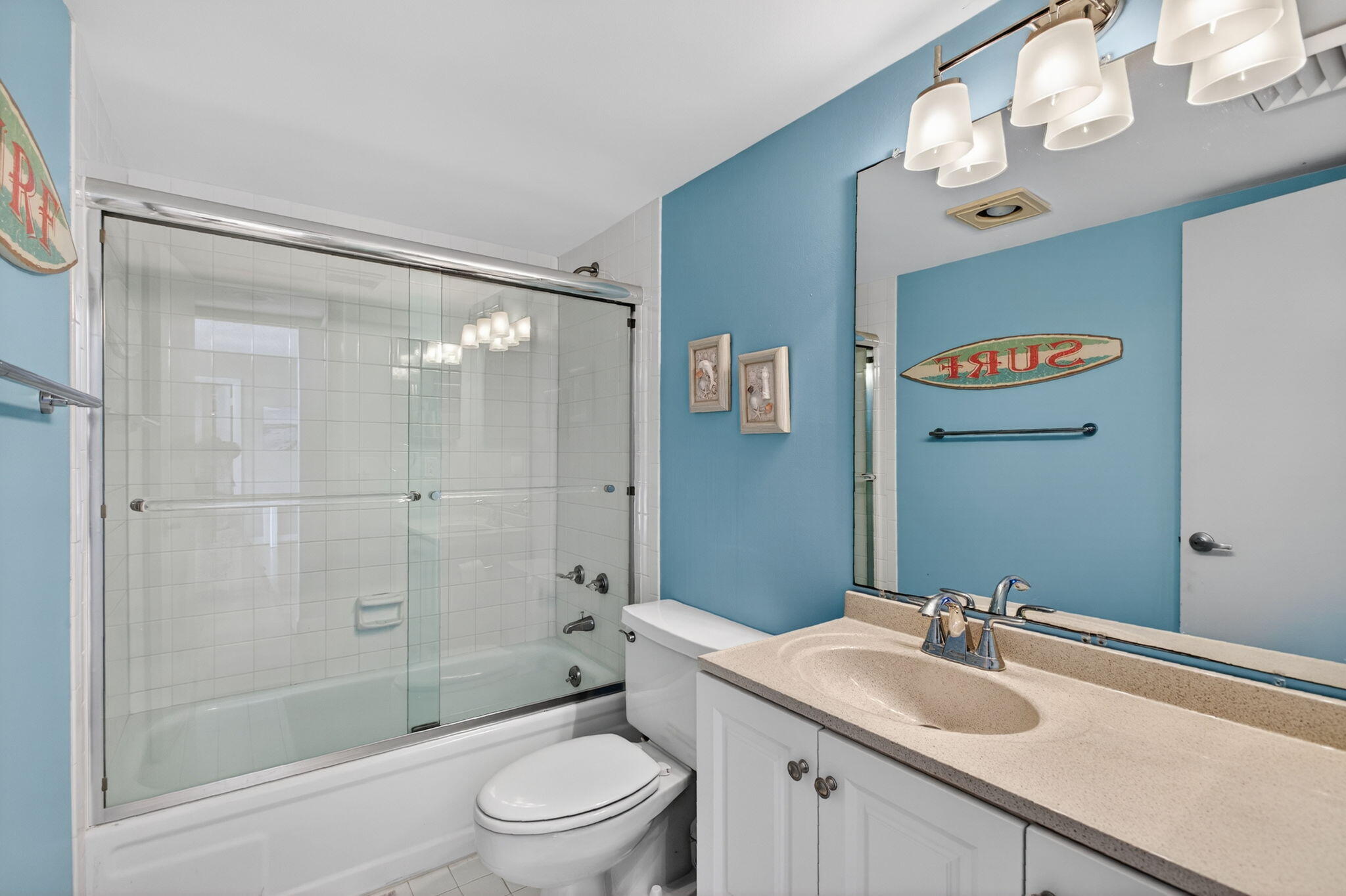 200 Ocean Trail Way, Unit 405 Jupiter, FL 33477 - Photo 22 of 46 a bathroom with a sink a toilet a mirror and shower