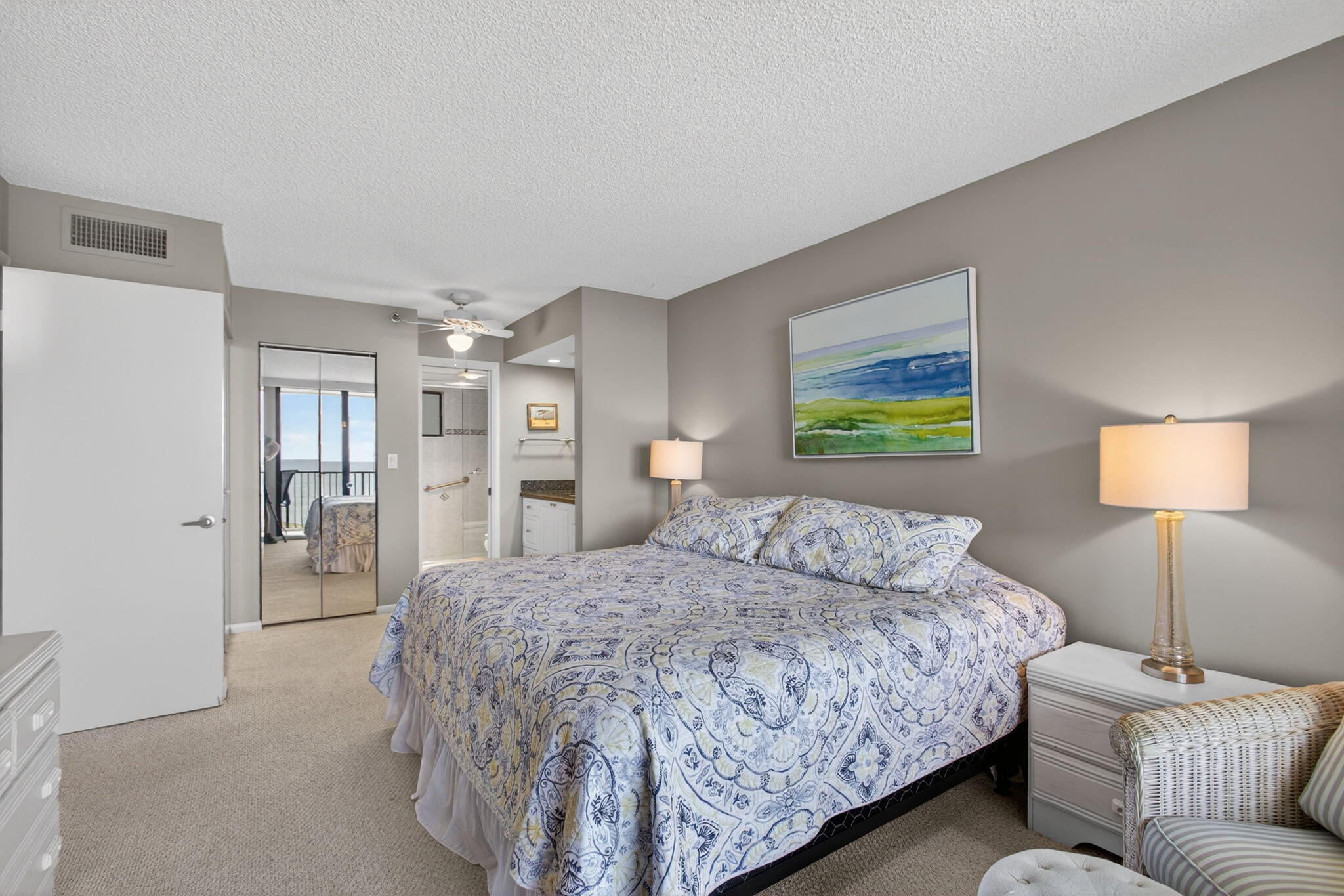 200 Ocean Trail Way, Unit 405 Jupiter, FL 33477 - Photo 23 of 46 a bedroom with a bed and a couch