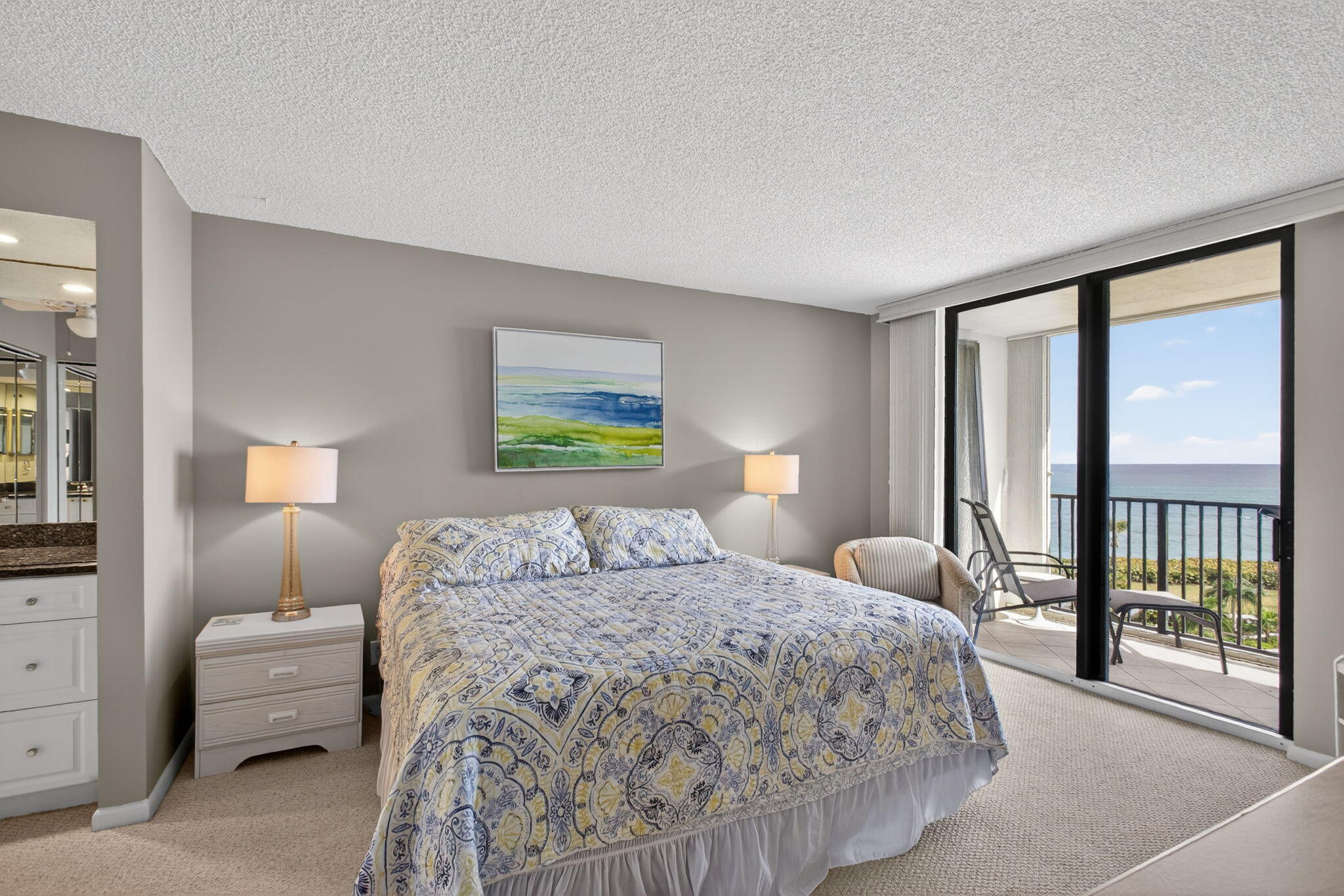 200 Ocean Trail Way, Unit 405 Jupiter, FL 33477 - Photo 24 of 46 a bedroom with a bed and a large window