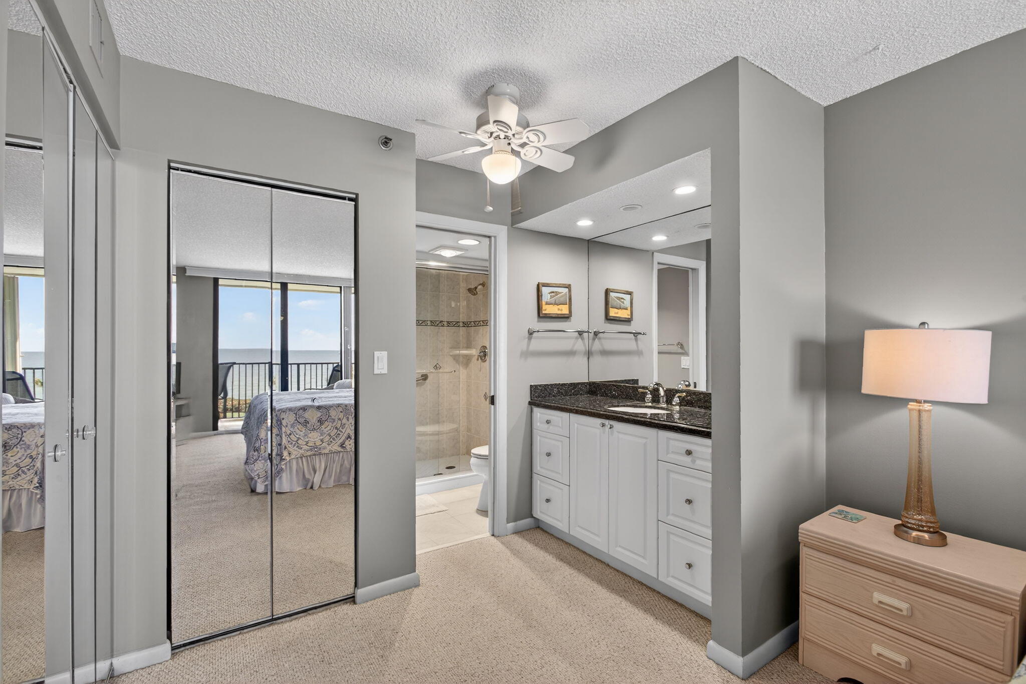200 Ocean Trail Way, Unit 405 Jupiter, FL 33477 - Photo 26 of 46 a hallway with white doors and chandelier