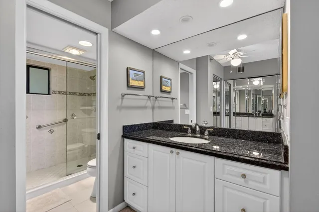 a bathroom with a shower and a toilet