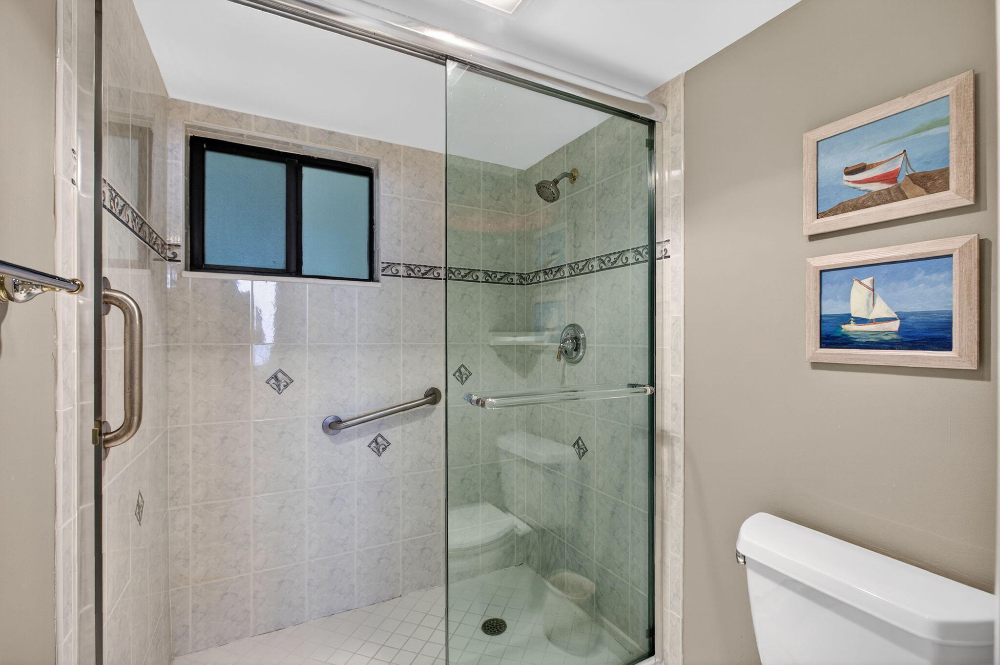 200 Ocean Trail Way, Unit 405 Jupiter, FL 33477 - Photo 28 of 46 a bathroom with a shower and a toilet