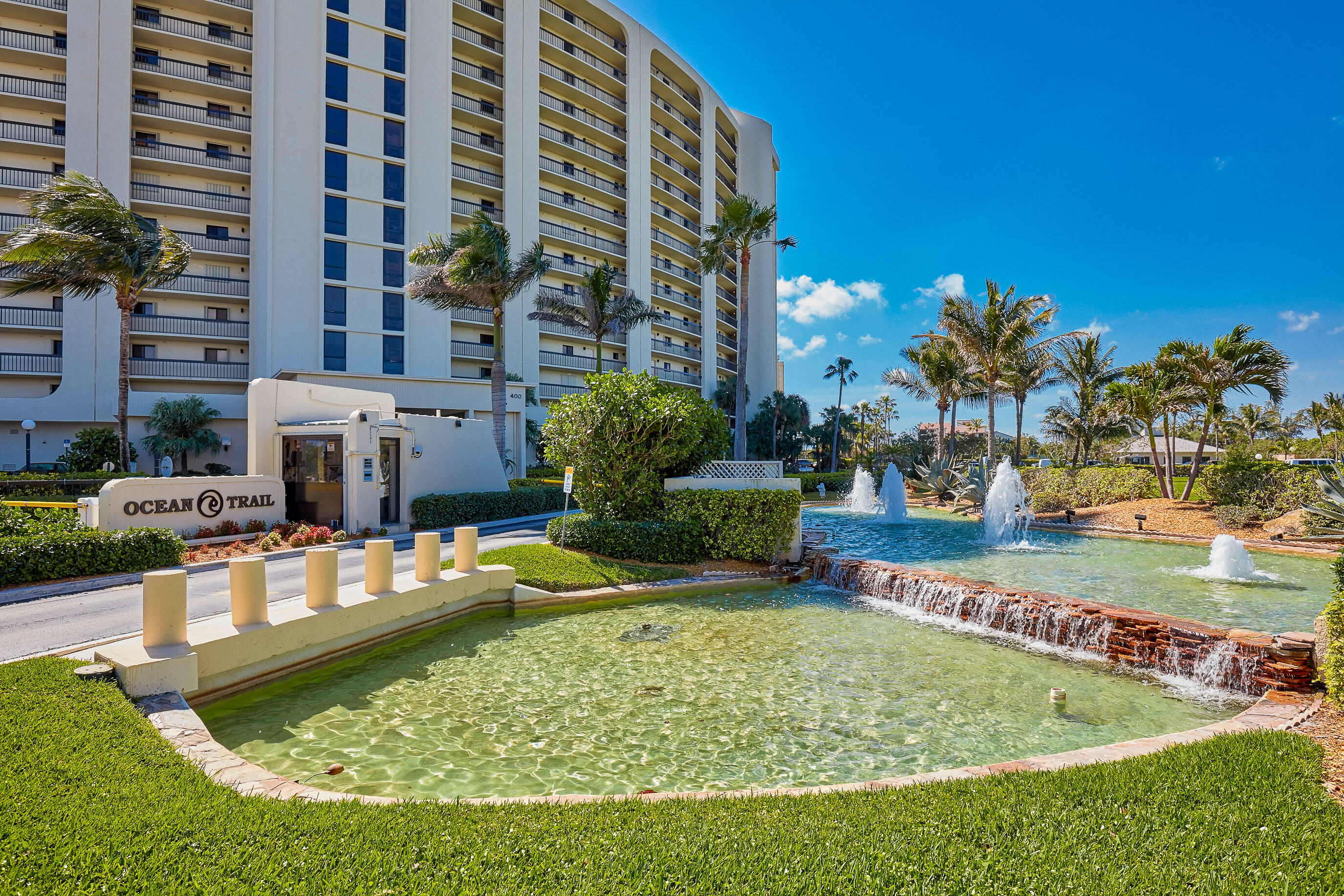 200 Ocean Trail Way, Unit 405 Jupiter, FL 33477 - Photo 38 of 46 a swimming pool with outdoor seating and yard