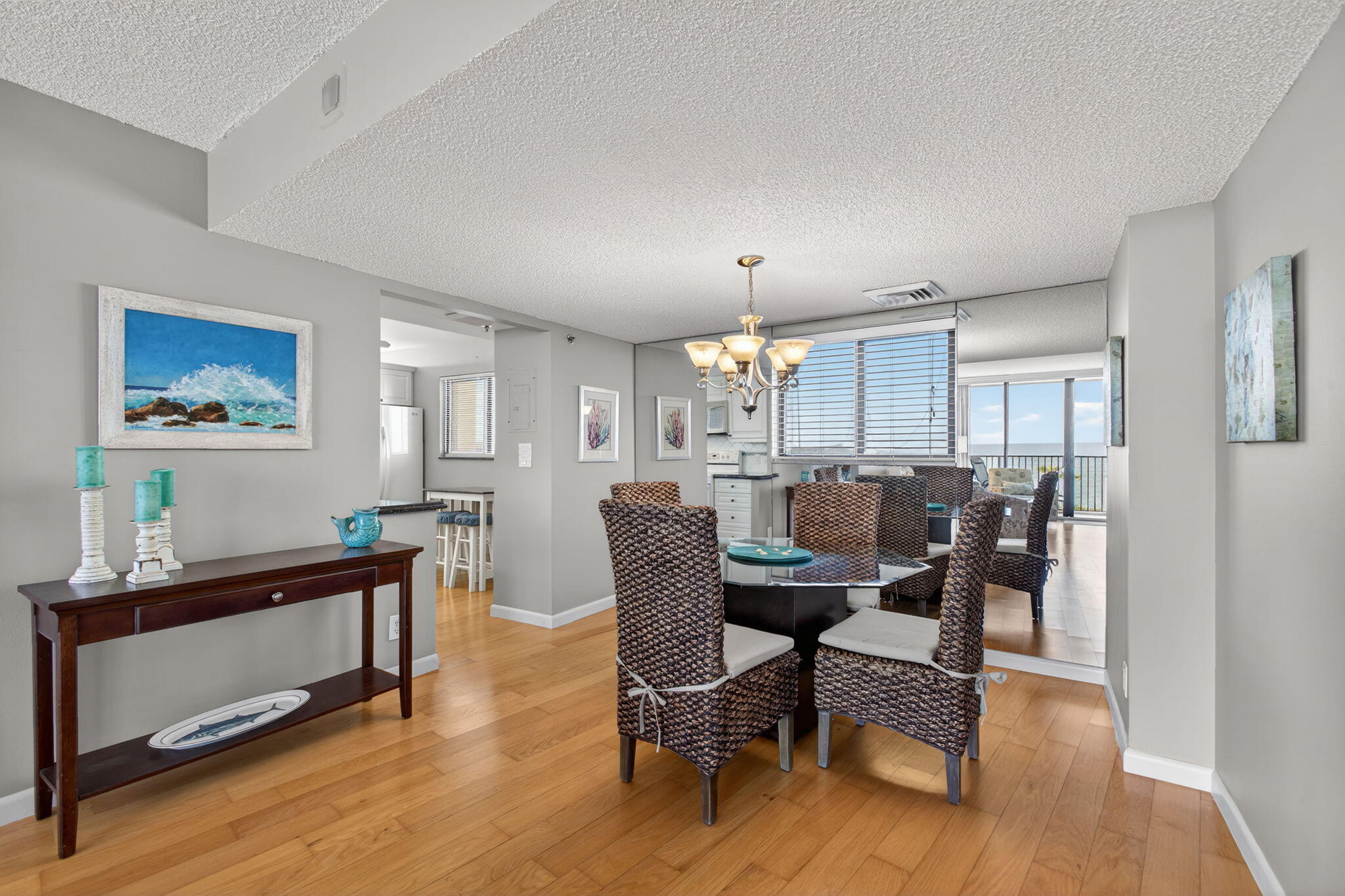 200 Ocean Trail Way, Unit 405 Jupiter, FL 33477 - Photo 6 of 46 a dining room with furniture a window and wooden floor