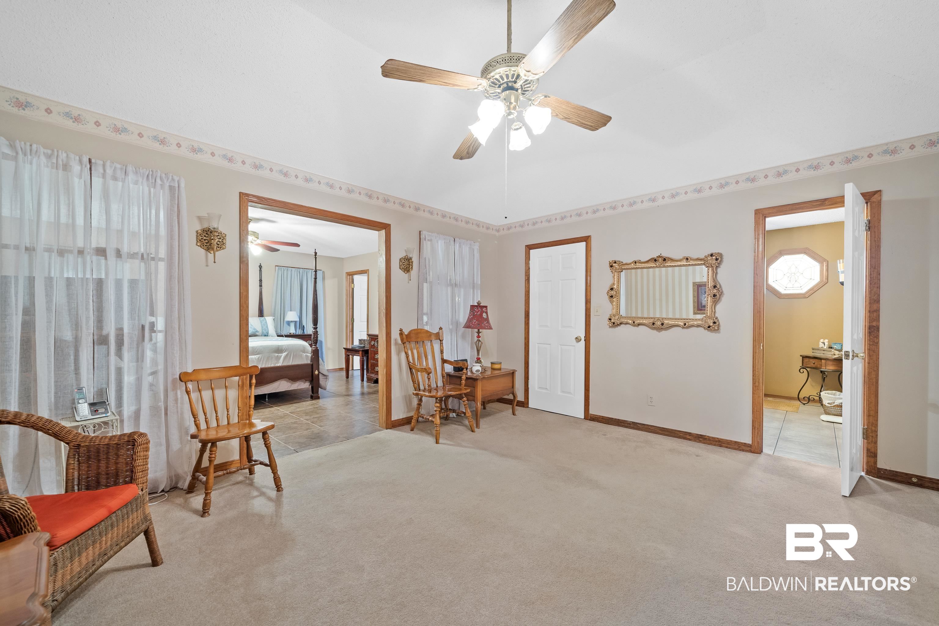 460 Ridgewood Drive Daphne, AL 36526 - Photo 16 of 31 Sitting room with ceiling fan and light colored carpet