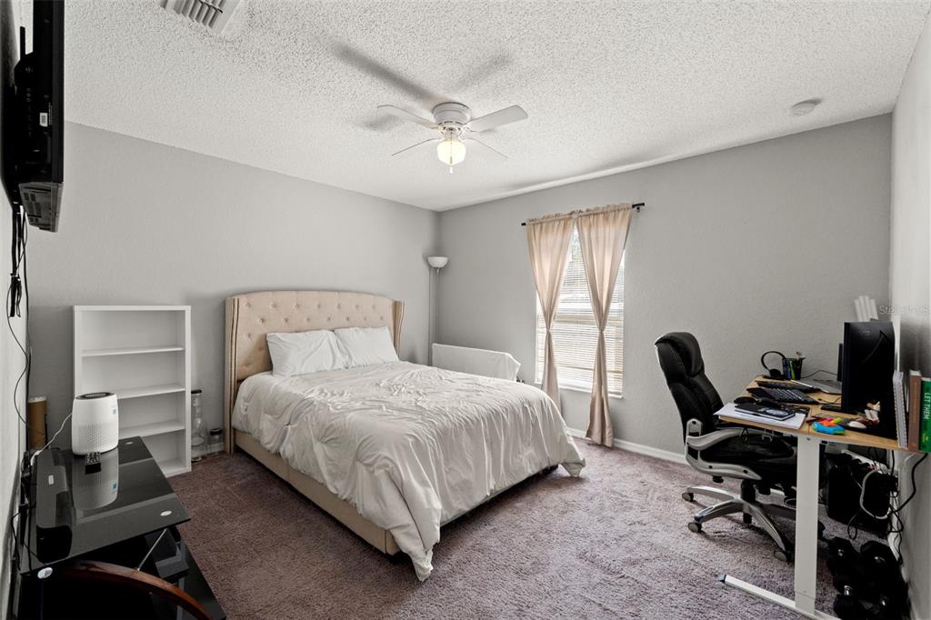 15335 Fleetwood Road Weeki Wachee, FL 34614 - Photo 29 of 40 a bedroom with a bed and a desk