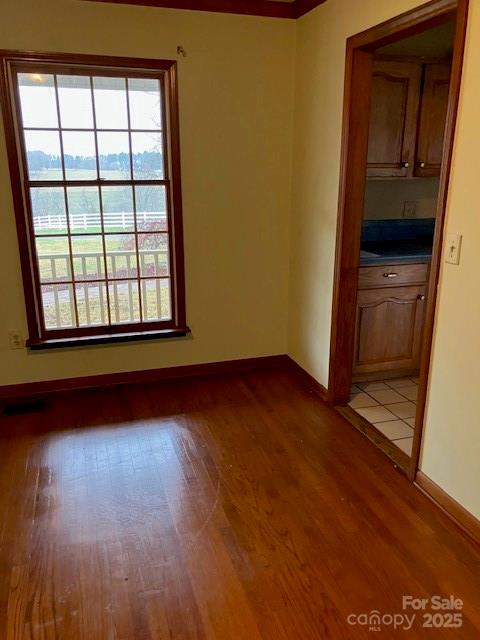4462-1 Hoover Road Lawndale, NC 28090 - Photo 12 of 38 an empty room with wooden floor and windows