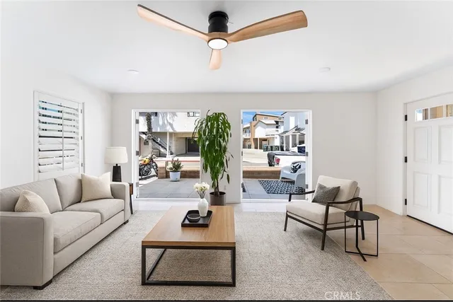 a living room with furniture rug and window
