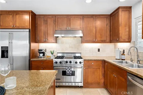 a kitchen with a stove and a sink