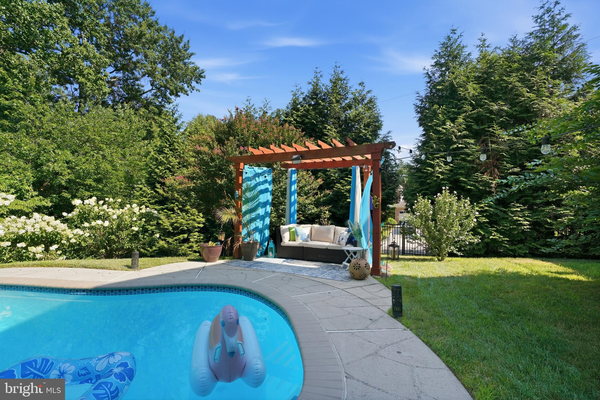 1419 Atwood Road Silver Spring, MD 20906 - Photo 42 of 48 Serene backyard oasis with poolside charm.