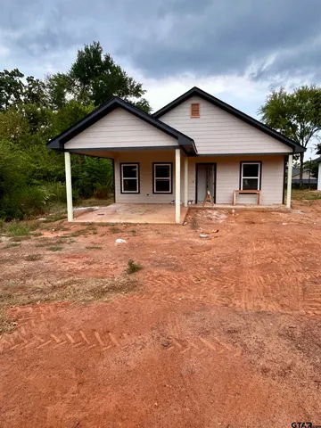 a front view of a house with yard