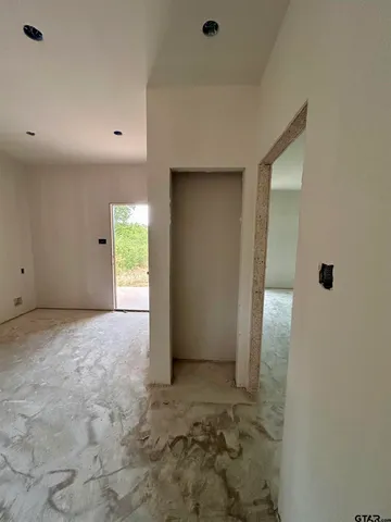 a view of an empty room with a window