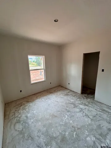 a view of empty room with windows