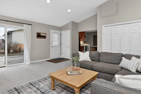 a living room with furniture and a table