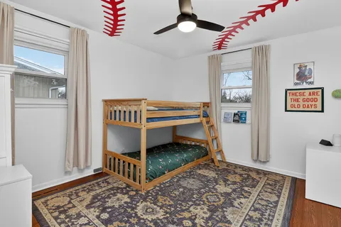 a bedroom with furniture and a rug