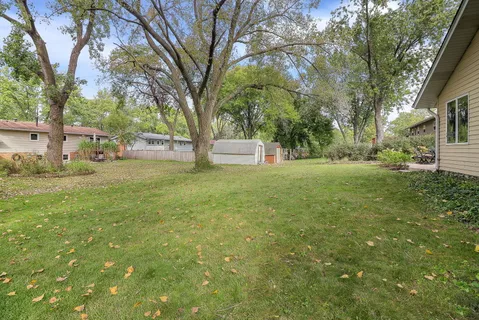 a view of a tree in front of a house