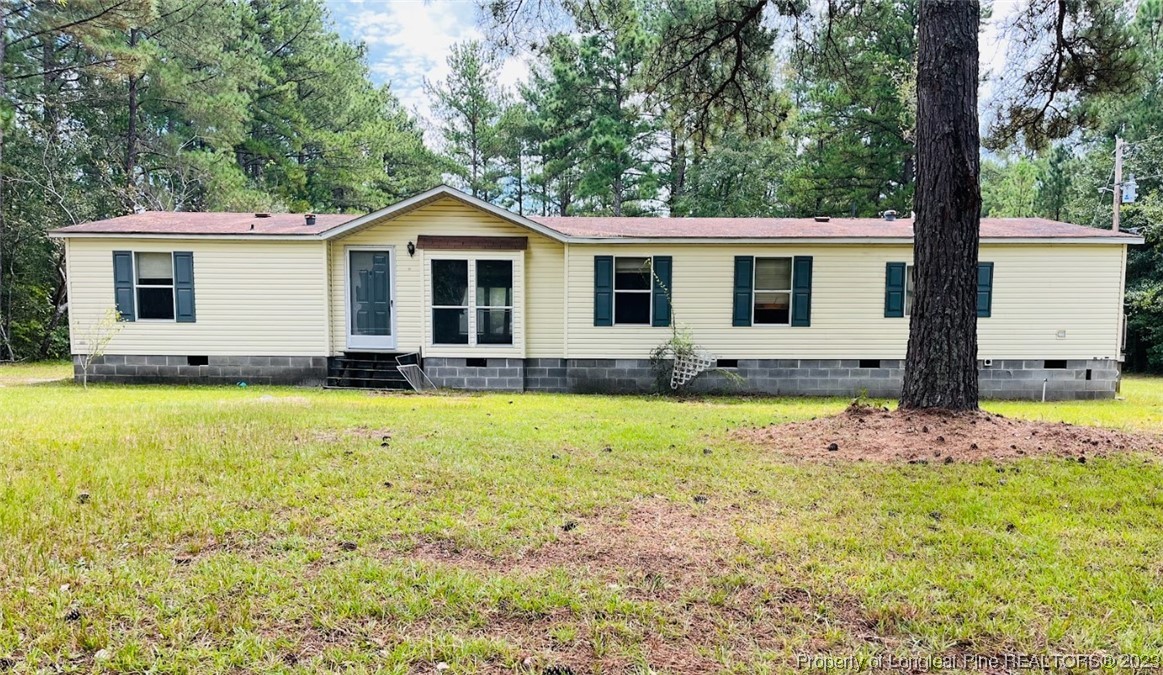 844 Boyd Lake Road Hamlet, NC 28345 - Photo 1 of 21 a front view of a house with a yard