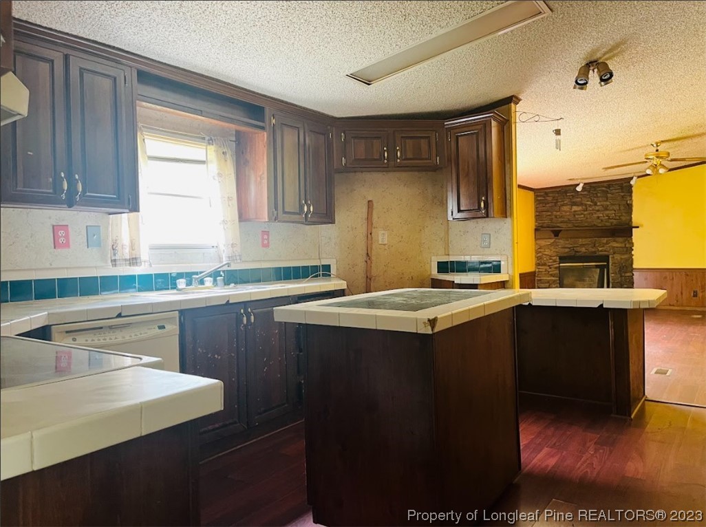844 Boyd Lake Road Hamlet, NC 28345 - Photo 5 of 21 a kitchen with a sink and a refrigerator