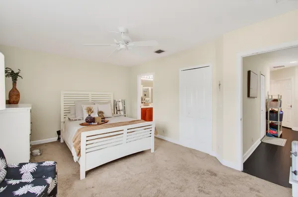 a bed room with a bed and a chandelier