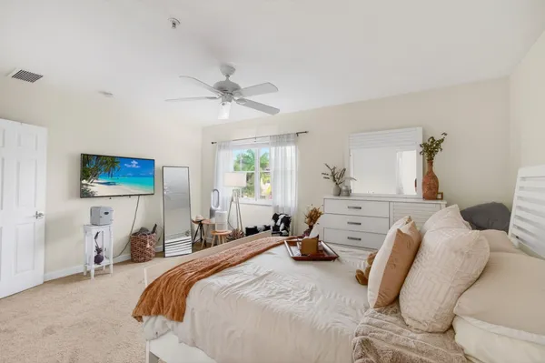a view of a livingroom with furniture and a flat screen tv