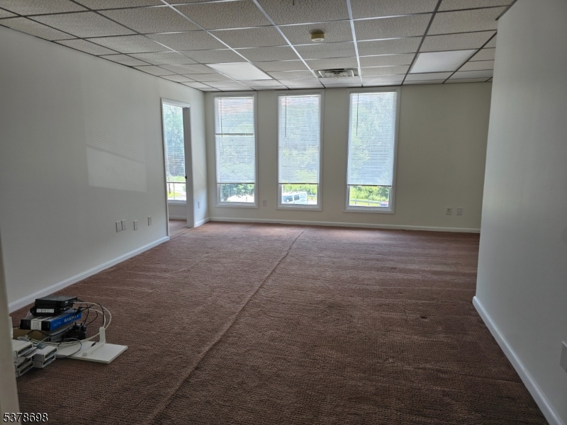 1 Highway 94, Unit E&F Vernon, NJ 07462 - Photo 2 of 4 an empty room with windows and outdoor space