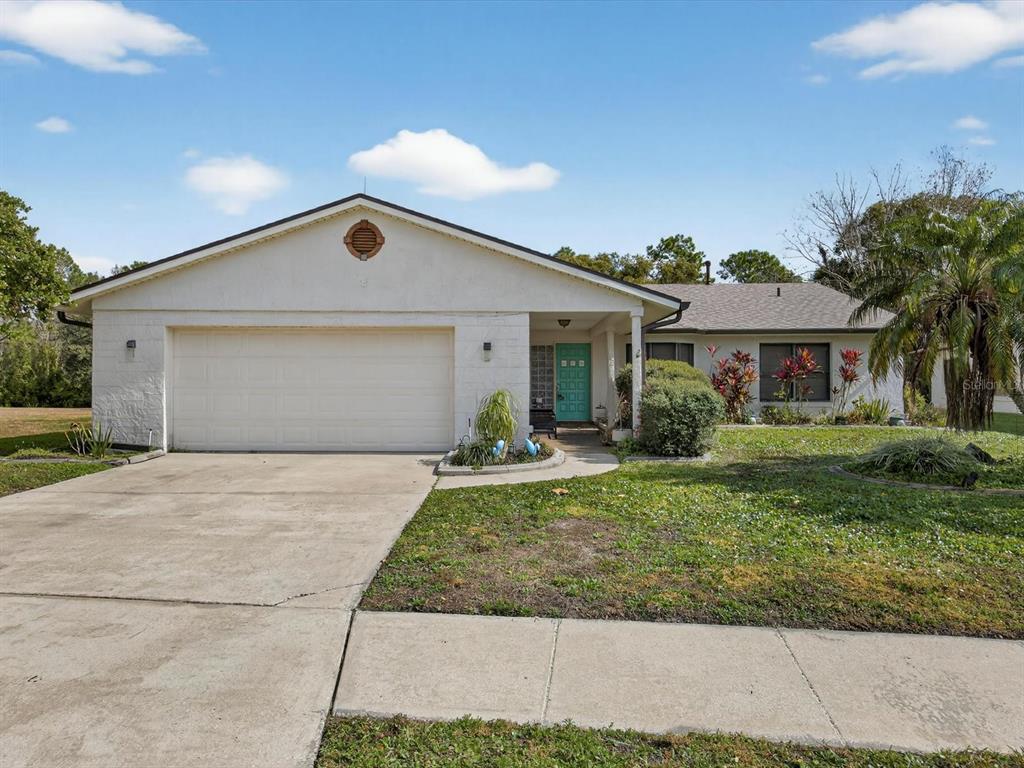 11321 Scenic View Lane Orlando, FL 32821 - Photo 1 of 29 a front view of a house with a yard