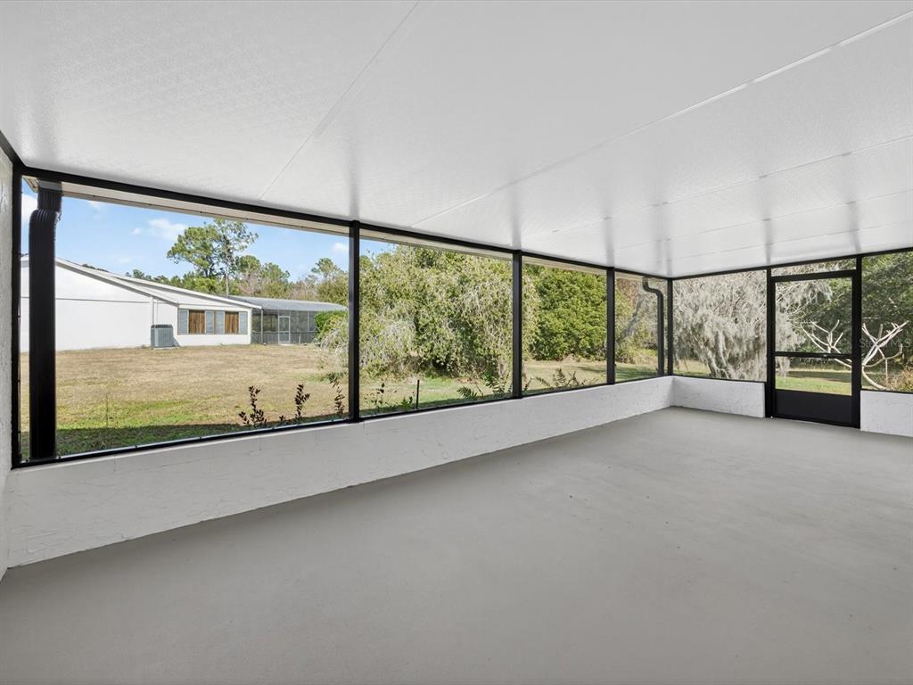 11321 Scenic View Lane Orlando, FL 32821 - Photo 20 of 29 wooden floor in an empty room with a large window