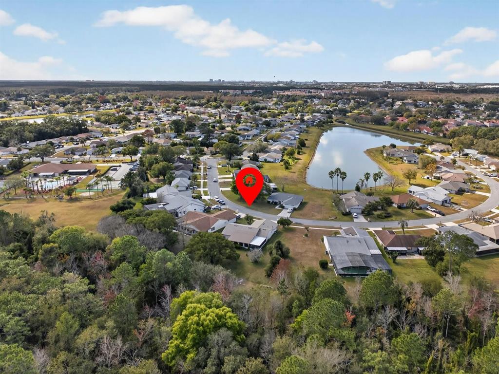 11321 Scenic View Lane Orlando, FL 32821 - Photo 28 of 29 an aerial view of a house with a swimming pool yard and mountain view in back