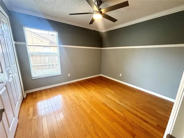 a swimming pool with wooden fence