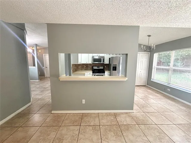 a kitchen with a sink stove and refrigerator