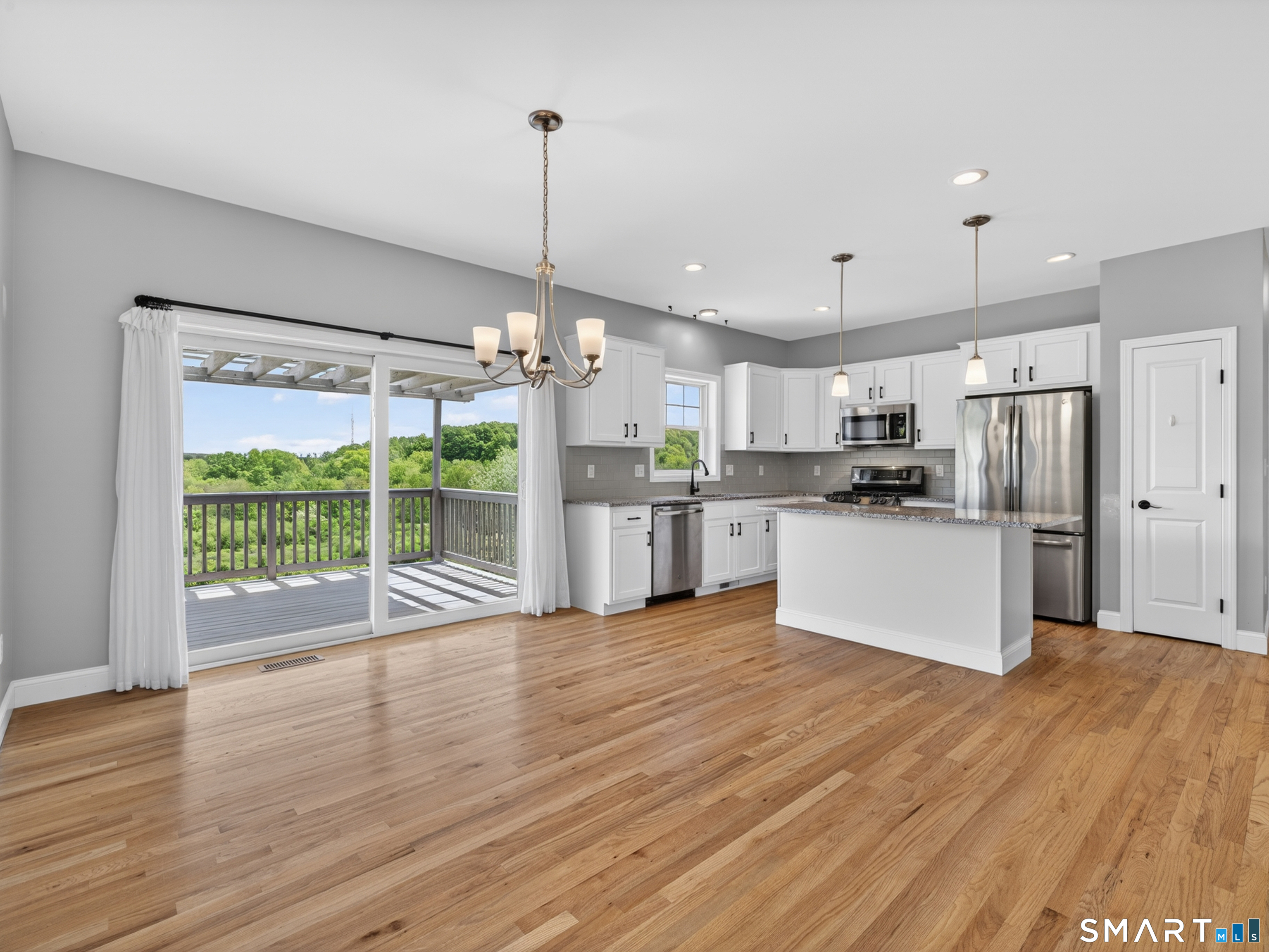 650 Ridgewood Road Middletown, CT 06457 - Photo 10 of 40 a kitchen with stainless steel appliances granite countertop a refrigerator a oven a stove and a wooden floors