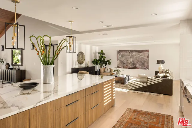 a kitchen with a sink stove and refrigerator