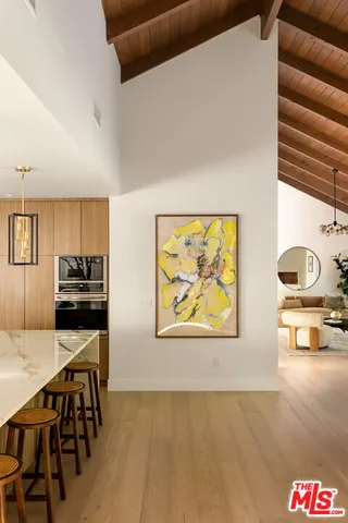 a large kitchen with lots of counter space and furniture