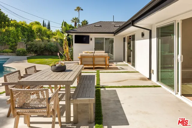 a living room filled with furniture and a table