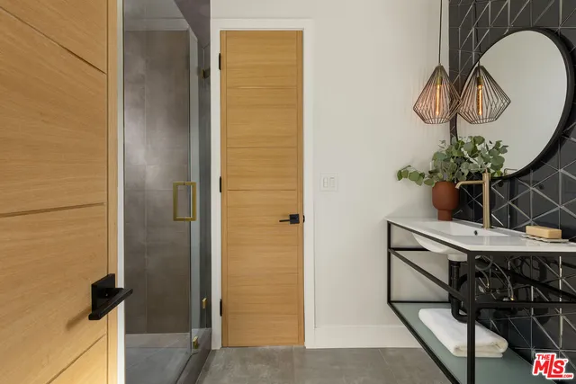 a table with wine bottles and glasses on it