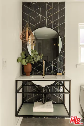 a bathroom with a sink and a washing machine