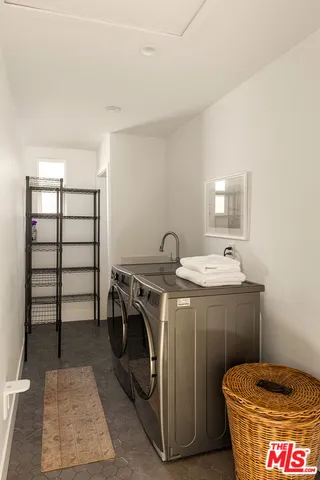 a bedroom with a bed and couch