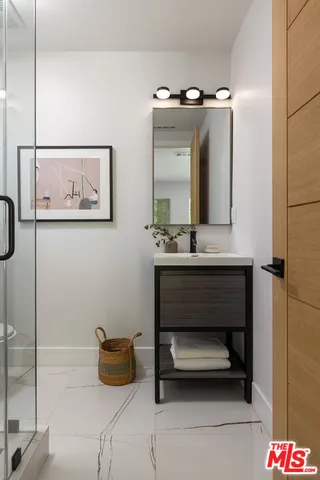 a indoor swimming pool with lawn chairs and potted plants