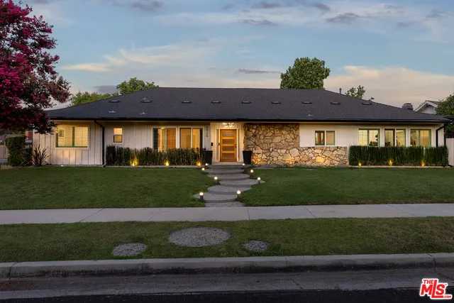 a view of a swimming pool and lounge chair