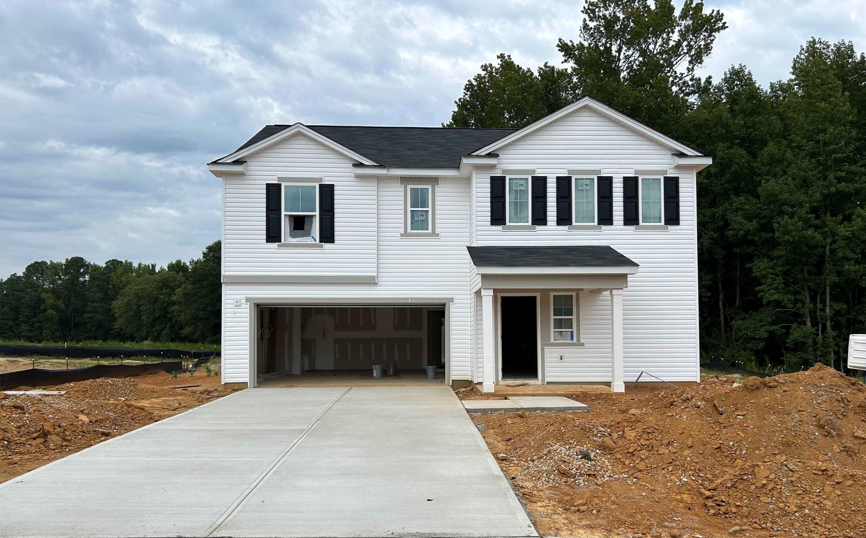 314 Riley Way Spring Hope, NC 27882 - Photo 1 of 42 a front view of a house with a yard and garage