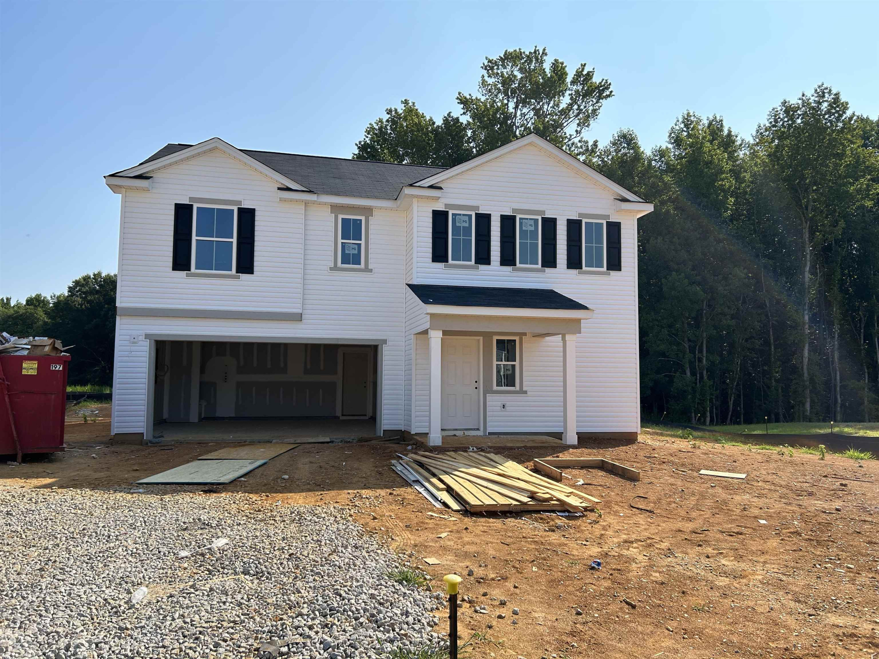 314 Riley Way Spring Hope, NC 27882 - Photo 16 of 42 a front view of a house with a yard and garage