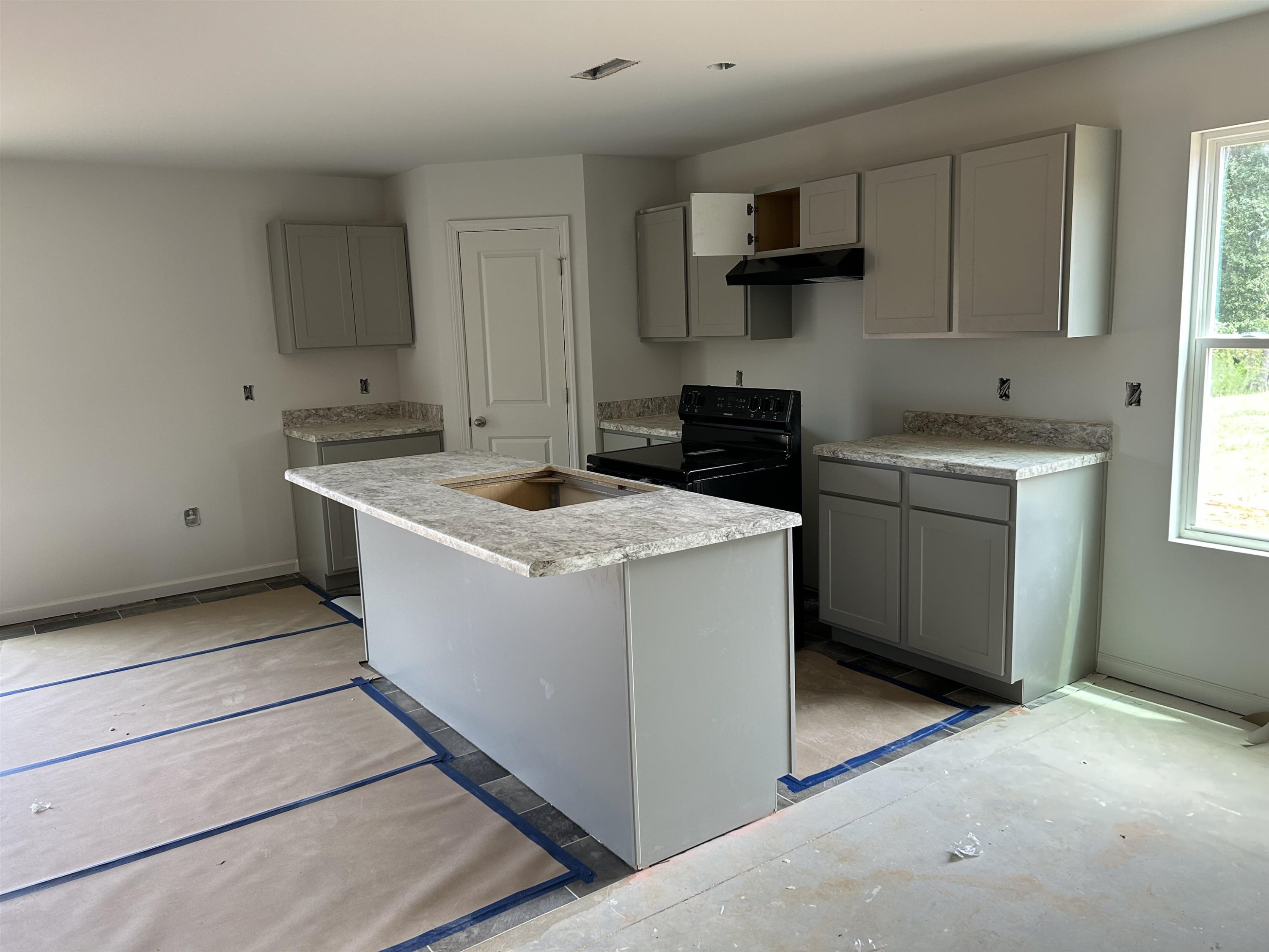 314 Riley Way Spring Hope, NC 27882 - Photo 3 of 42 a kitchen that has a sink and a stove in it