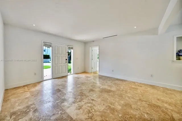 an empty room with natural light