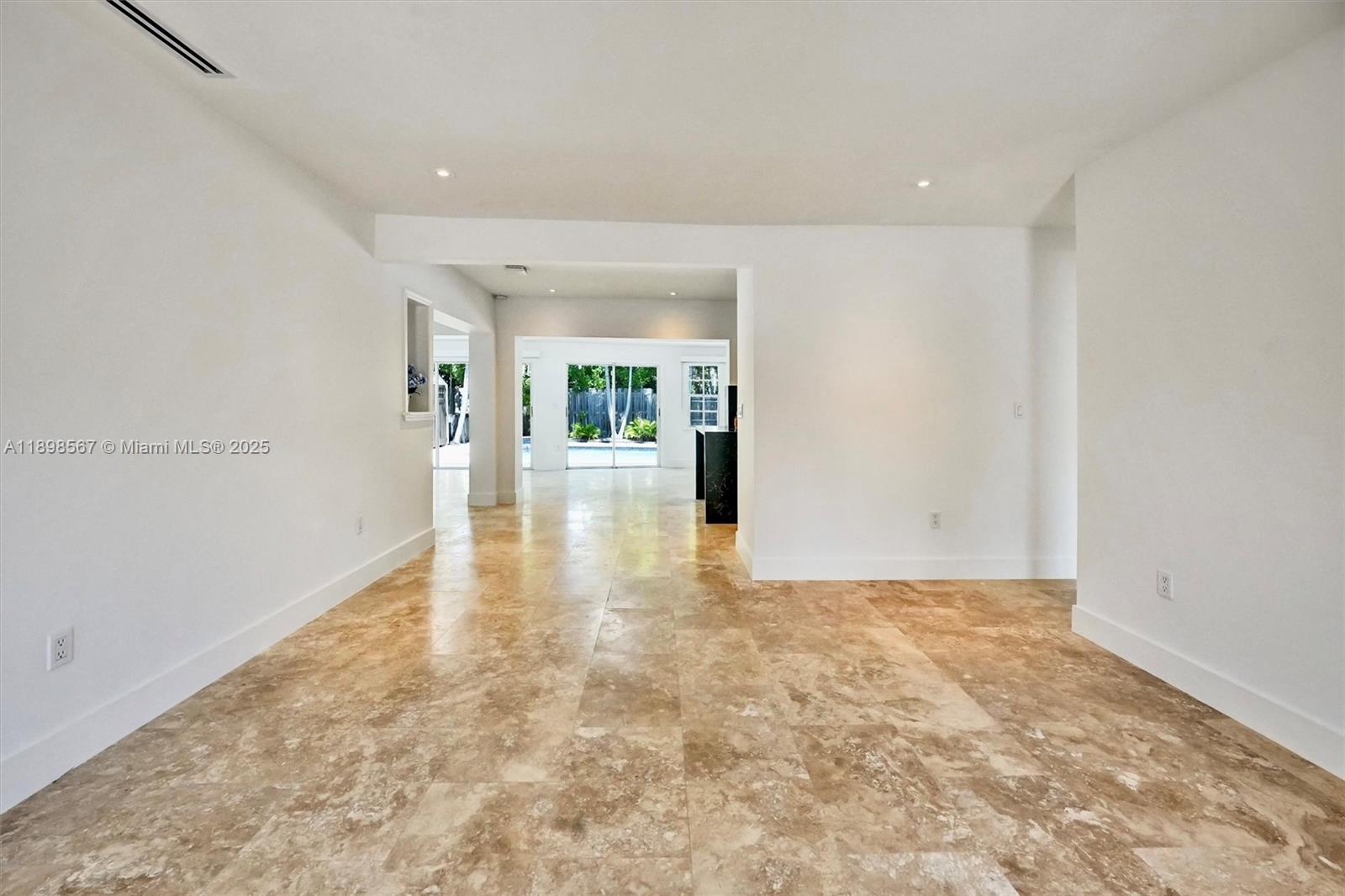 255 Ridgewood Road Key Biscayne, FL 33149 - Photo 18 of 55 an empty room with natural light