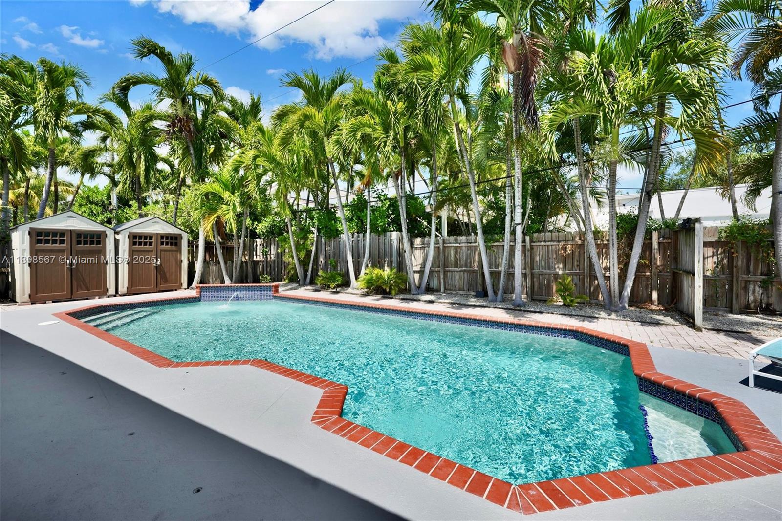 255 Ridgewood Road Key Biscayne, FL 33149 - Photo 2 of 55 a view of a backyard with swimming pool