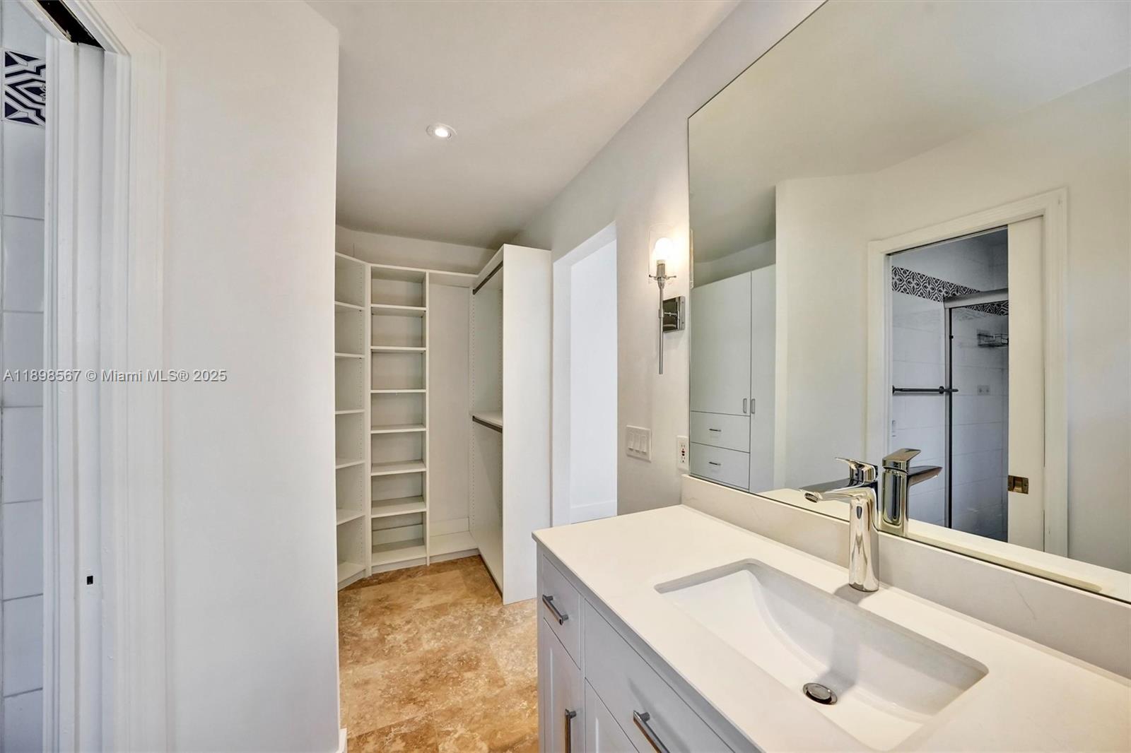 255 Ridgewood Road Key Biscayne, FL 33149 - Photo 22 of 55 a bathroom with a sink and a mirror