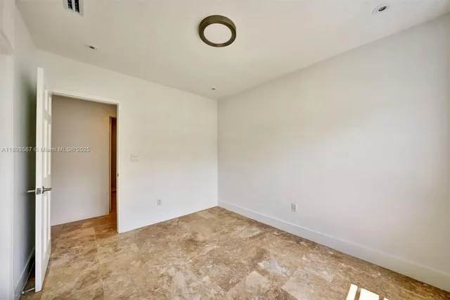 a view of empty room with windows