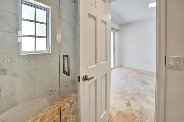 a kitchen with a refrigerator and a sink